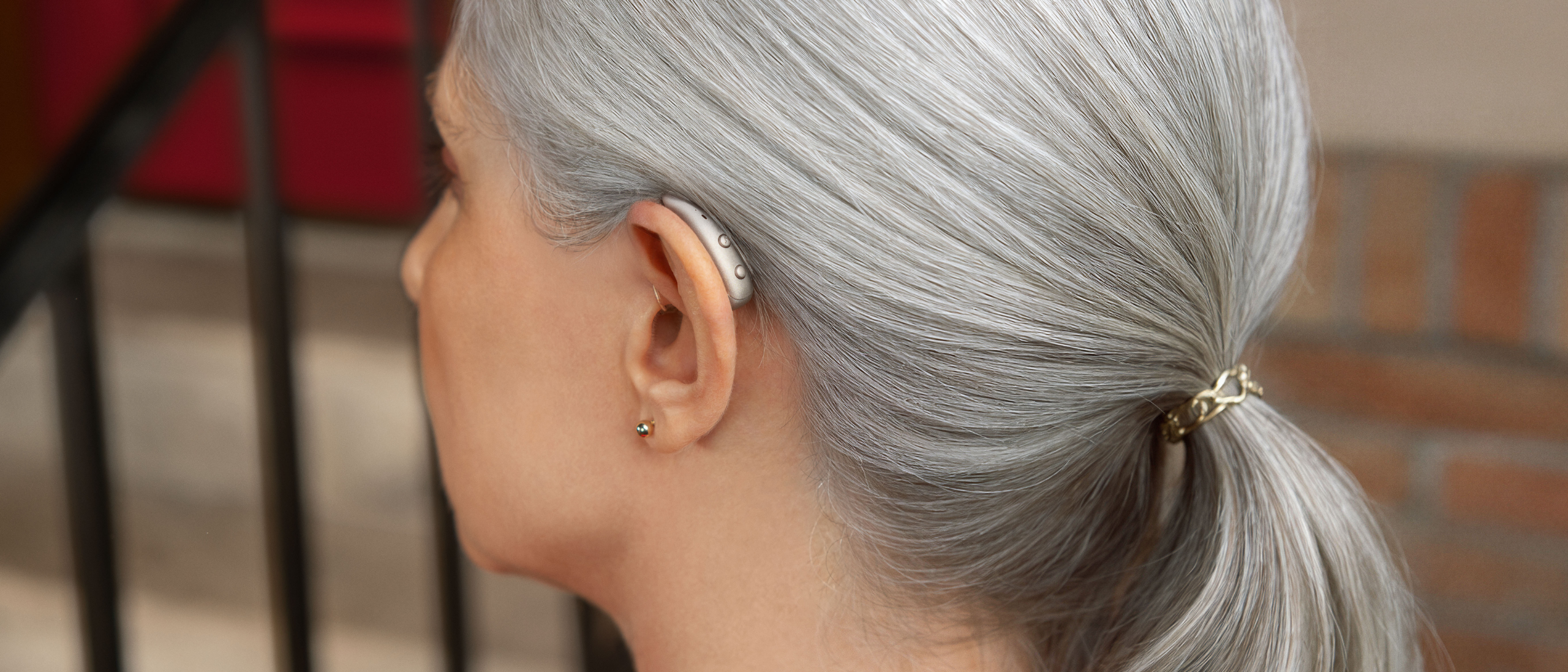 Woman with Signia MaX on ear