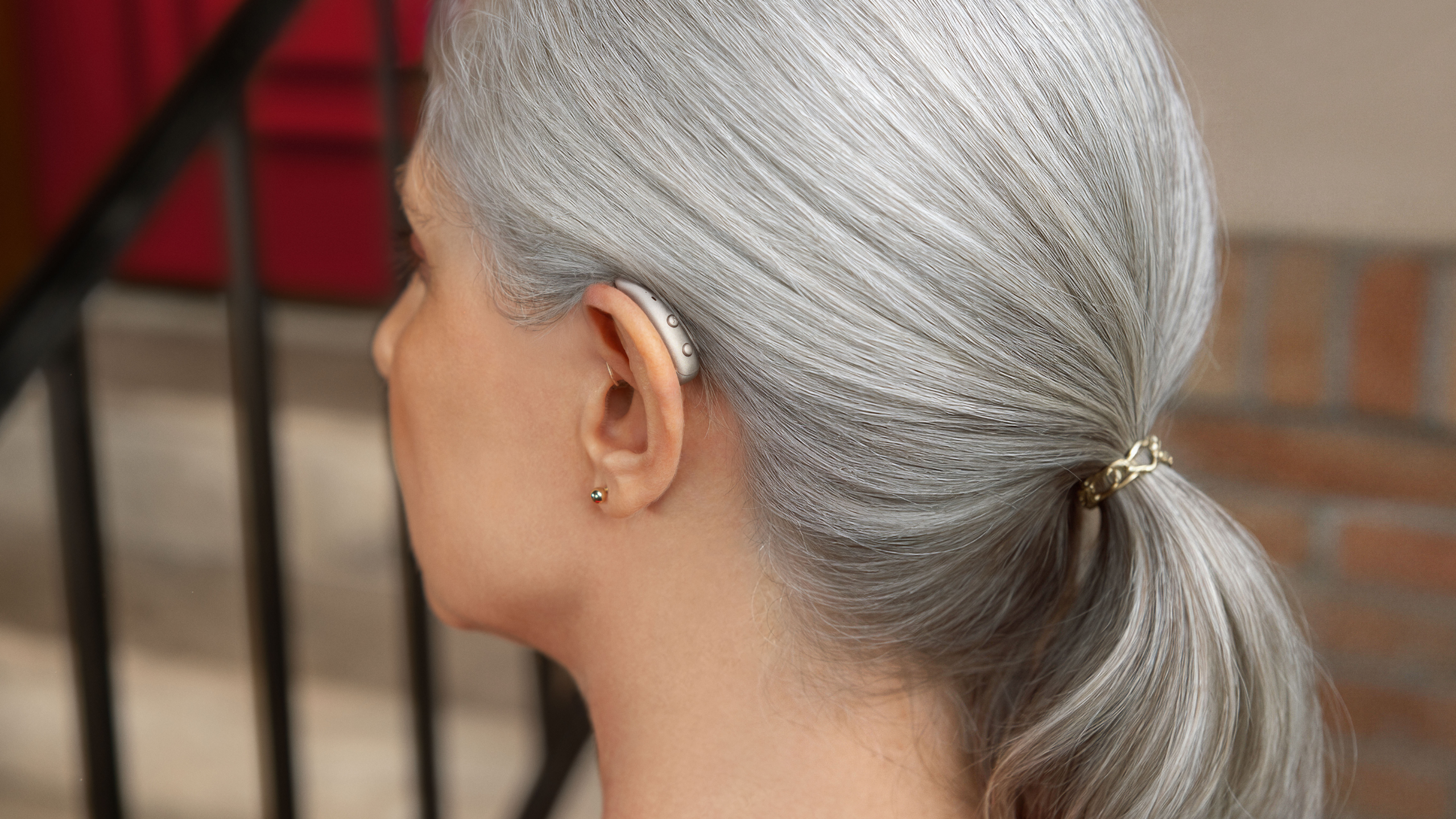 Woman with Signia MaX on ear