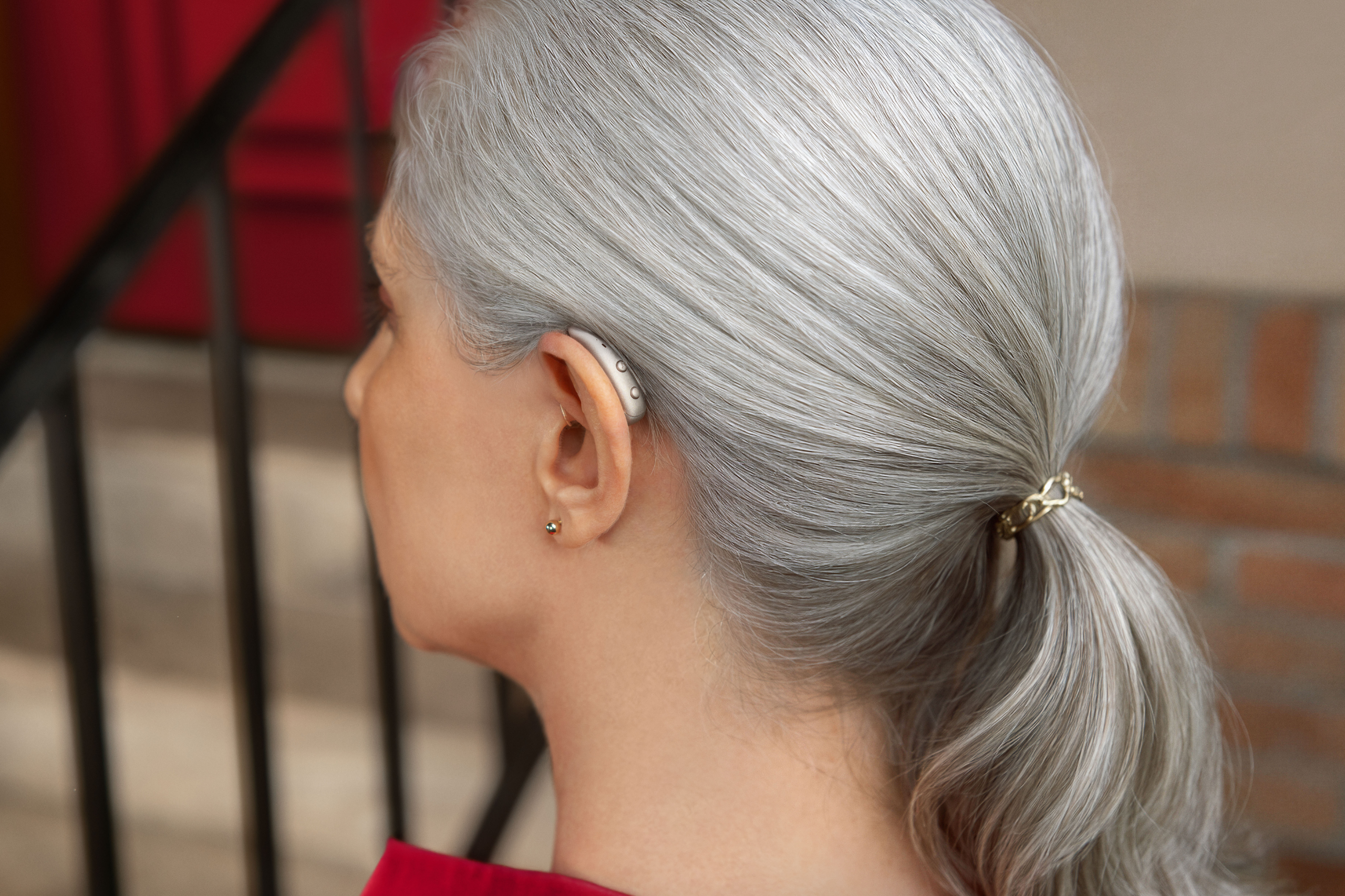 Woman with Signia MaX on ear